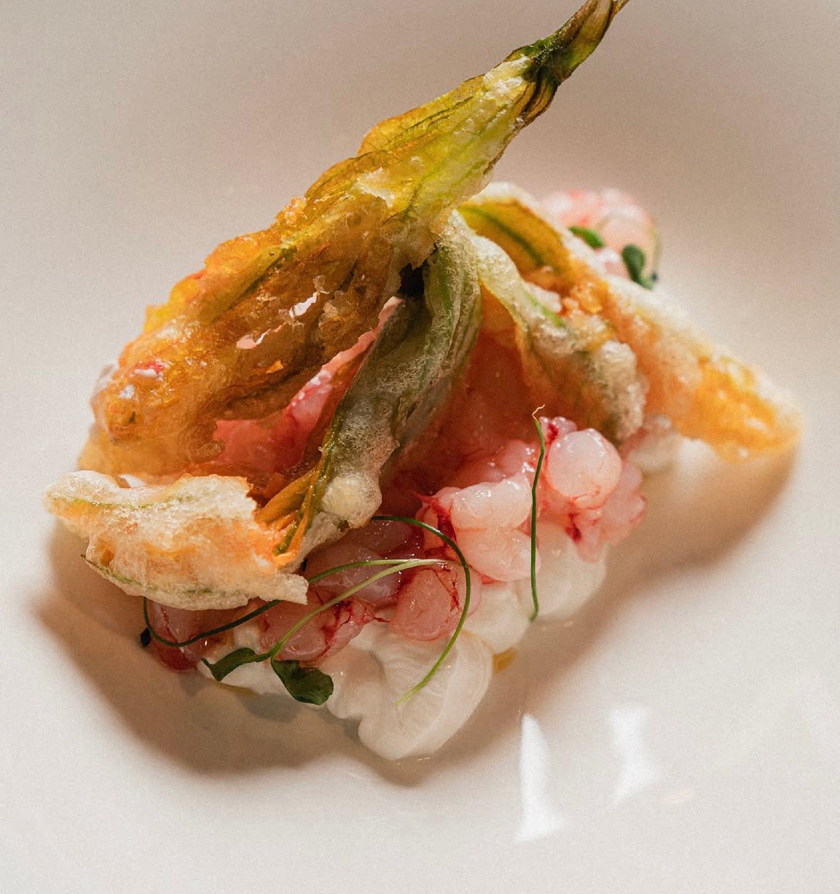 Raw seafood dish with courgette flowers